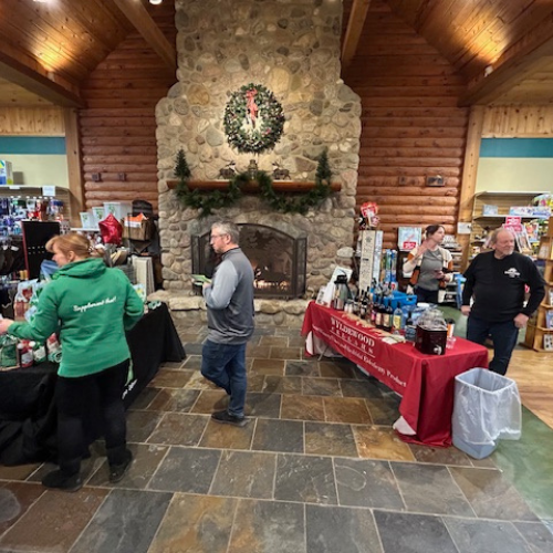 Prairieland Feeds staff holding a table event