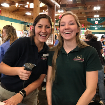 Prairieland staff behind the cash register smiling 