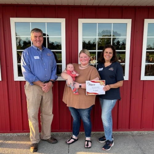 Prairieland Feed staff holding a first place award